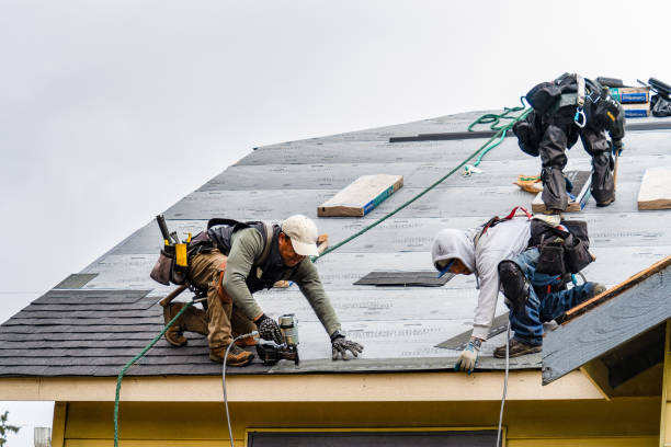 Professional Emergency Roof Repair technician working in West Groton, MA
